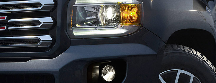 Image of the front left headlight on the 2017 GMC Canyon small pickup truck.