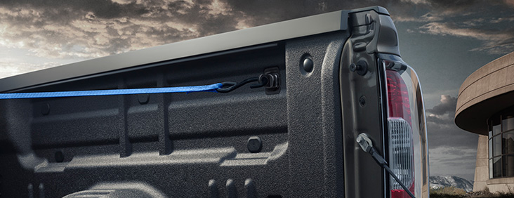 Image of the upper tie-downs and bed liner on the 2017 GMC Canyon, providing quality cargo management