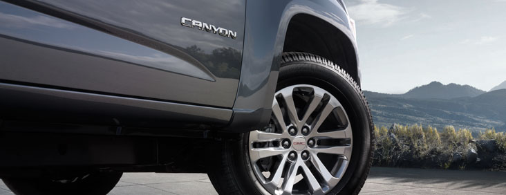 Image of the front right wheel well on the 2017 GMC Canyon small pickup truck, showing the Canyon logo text.